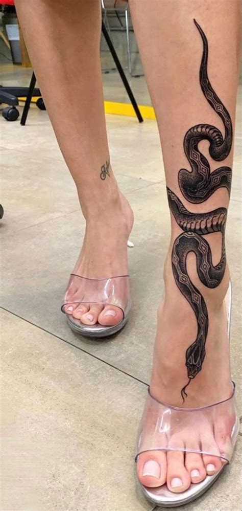 snake wrapped around leg tattoo|Snake tattoos around leg